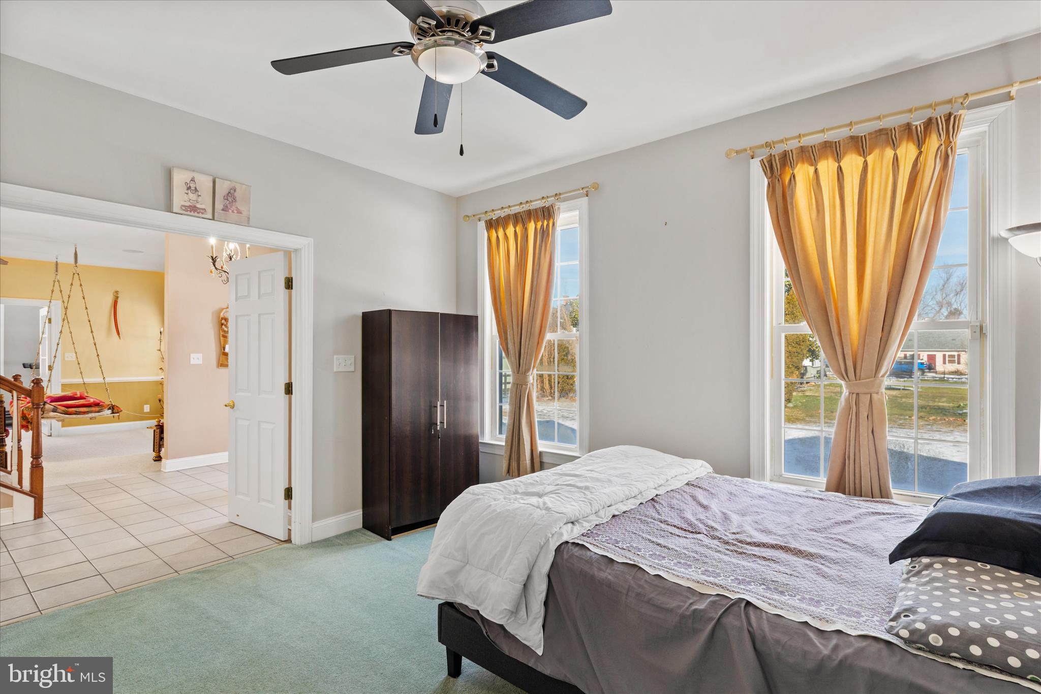 108 Franklin Avenue Berlin, MD 21811 - Photo 33 of 62 a bedroom with a bed and a chandelier