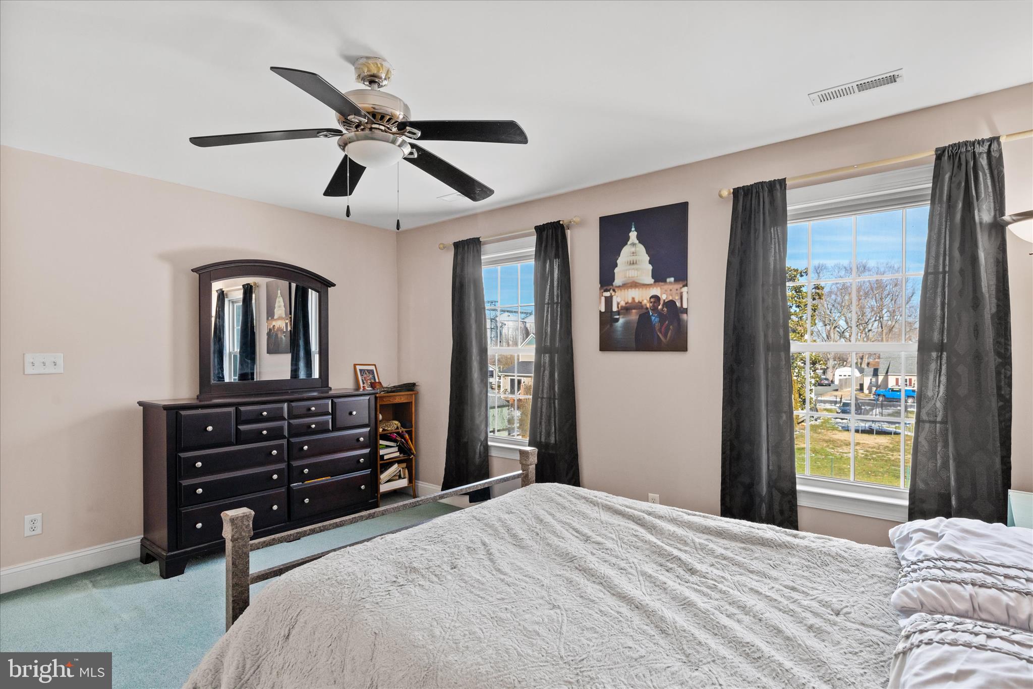 108 Franklin Avenue Berlin, MD 21811 - Photo 38 of 62 a bedroom with a bed and a chandelier
