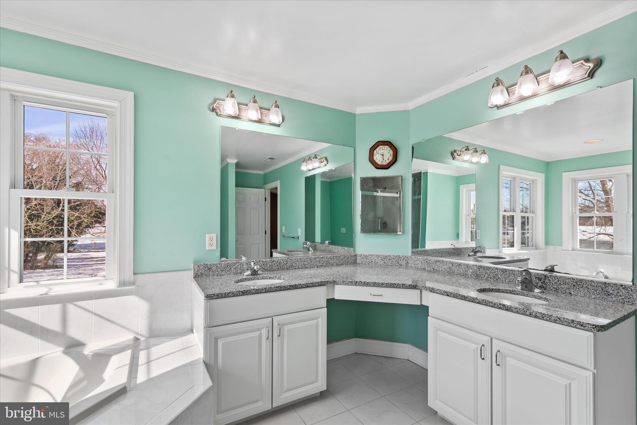 108 Franklin Avenue Berlin, MD 21811 - Photo 46 of 62 a bathroom with a granite countertop sink and a large mirror