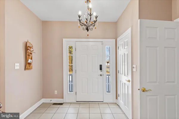 a view of a chandelier in a hallway