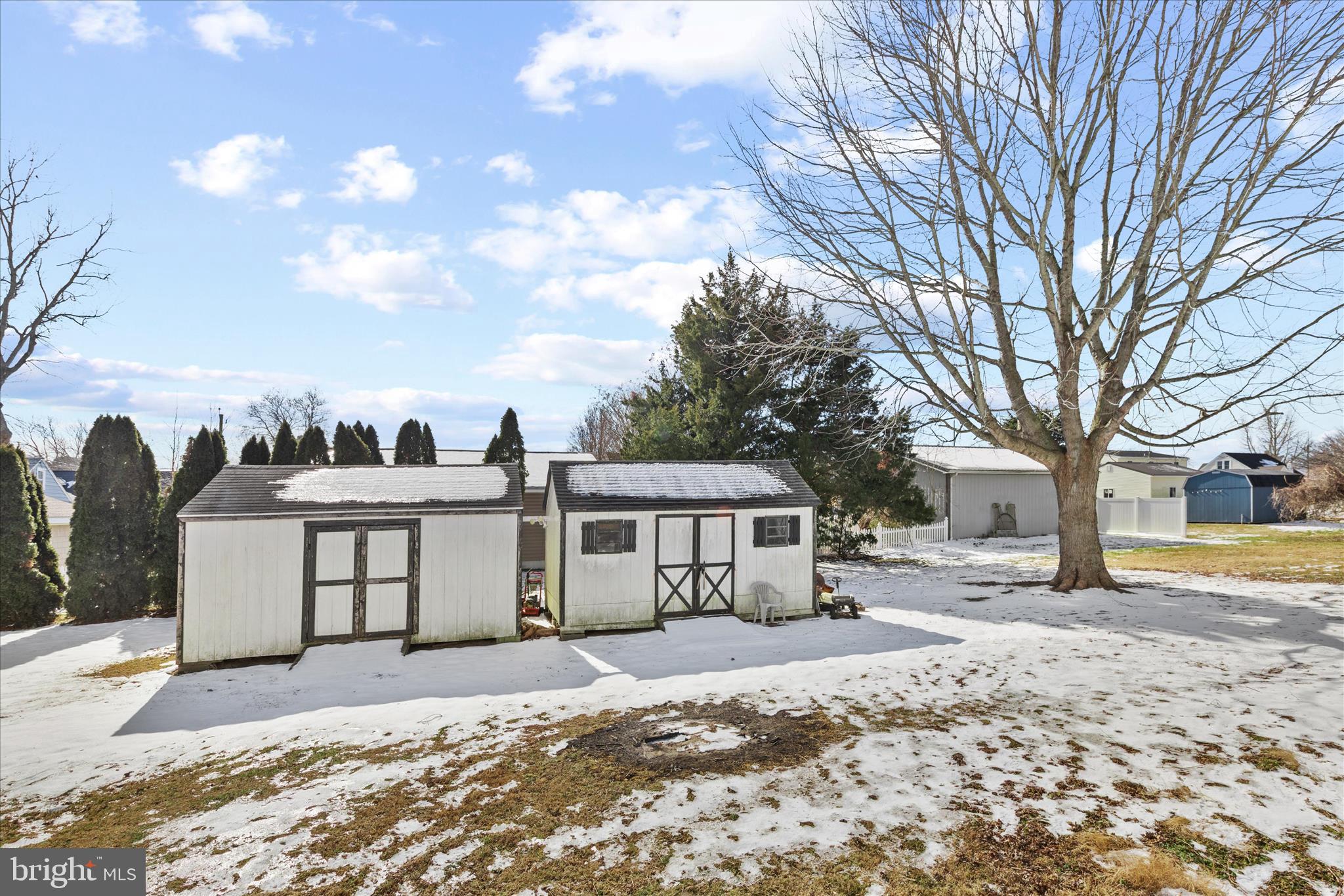 108 Franklin Avenue Berlin, MD 21811 - Photo 60 of 62 a view of a house with a yard covered in snow