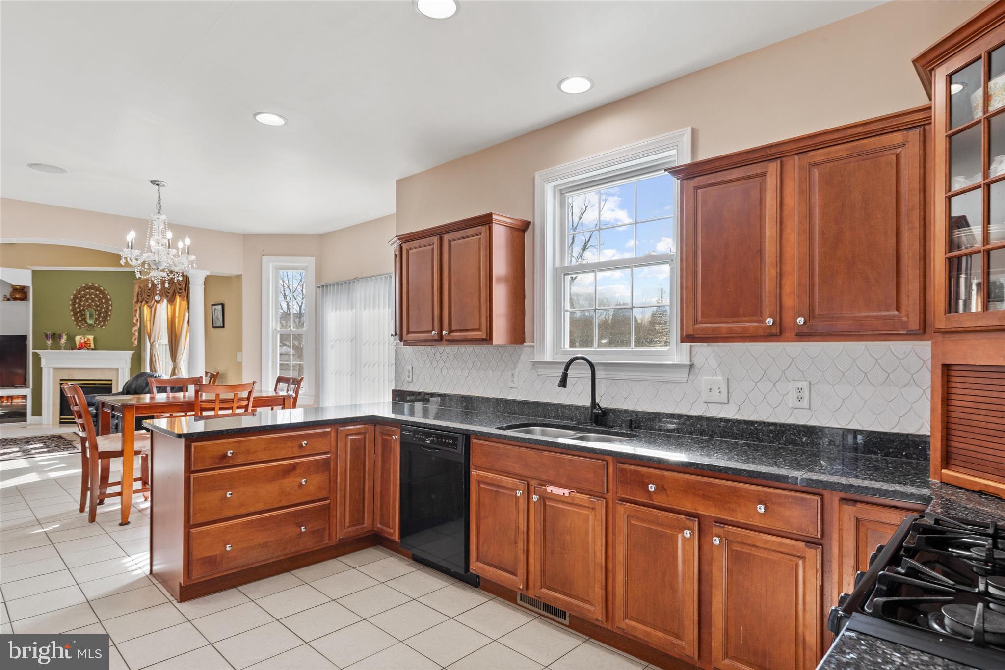 108 Franklin Avenue Berlin, MD 21811 - Photo 10 of 62 a kitchen with stainless steel appliances granite countertop a sink stove and cabinets