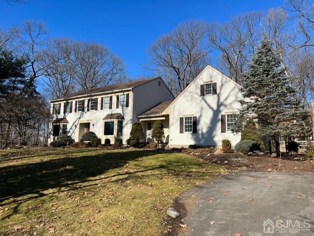 55 Big Spring Road Califon, NJ 07830 - Photo 1 of 53 a view of a white house with a yard covered with snow and trees