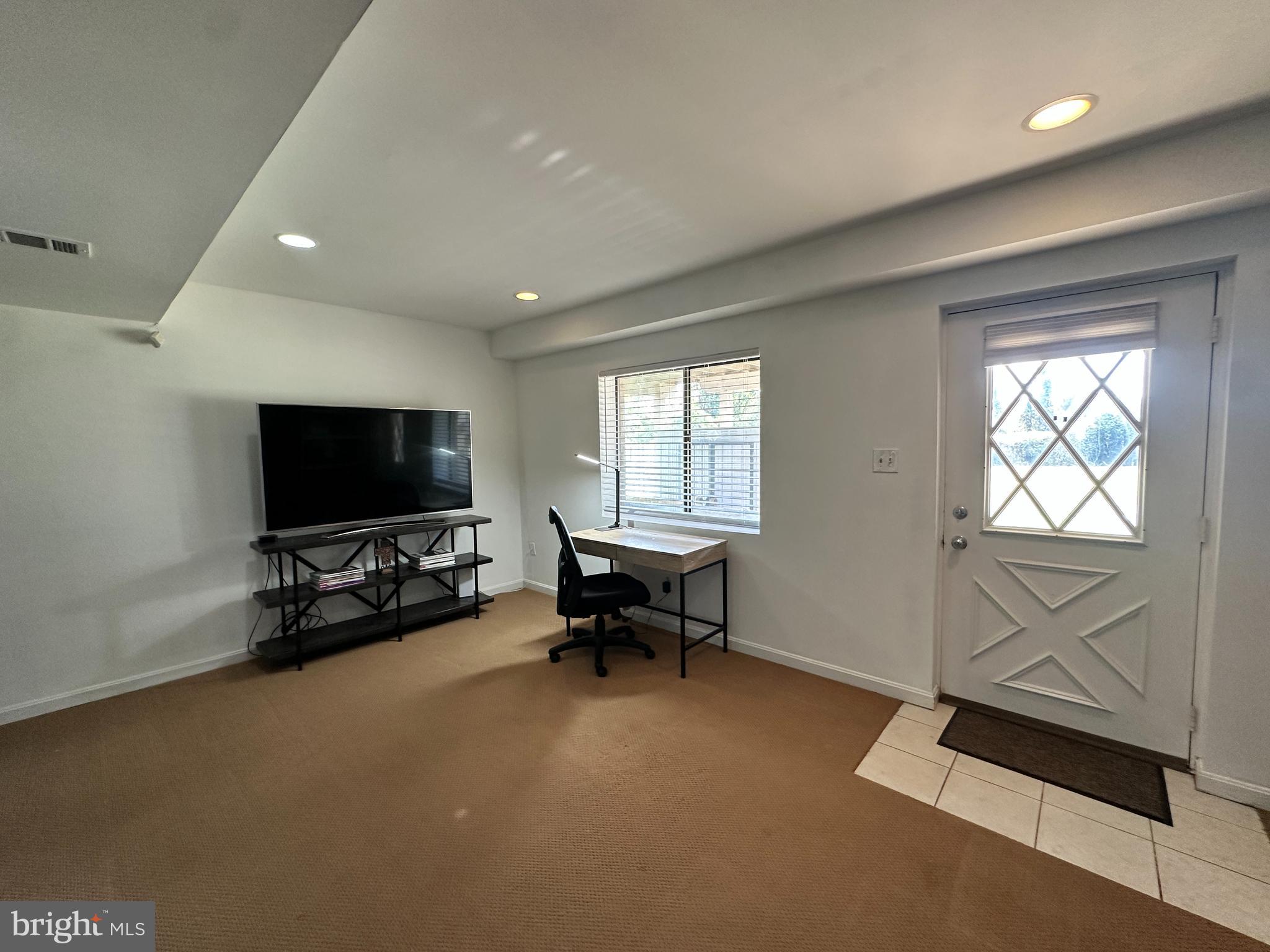 7601 Rudyard Street Falls Church, VA 22043 - Photo 19 of 29 a living room with furniture and a flat screen tv