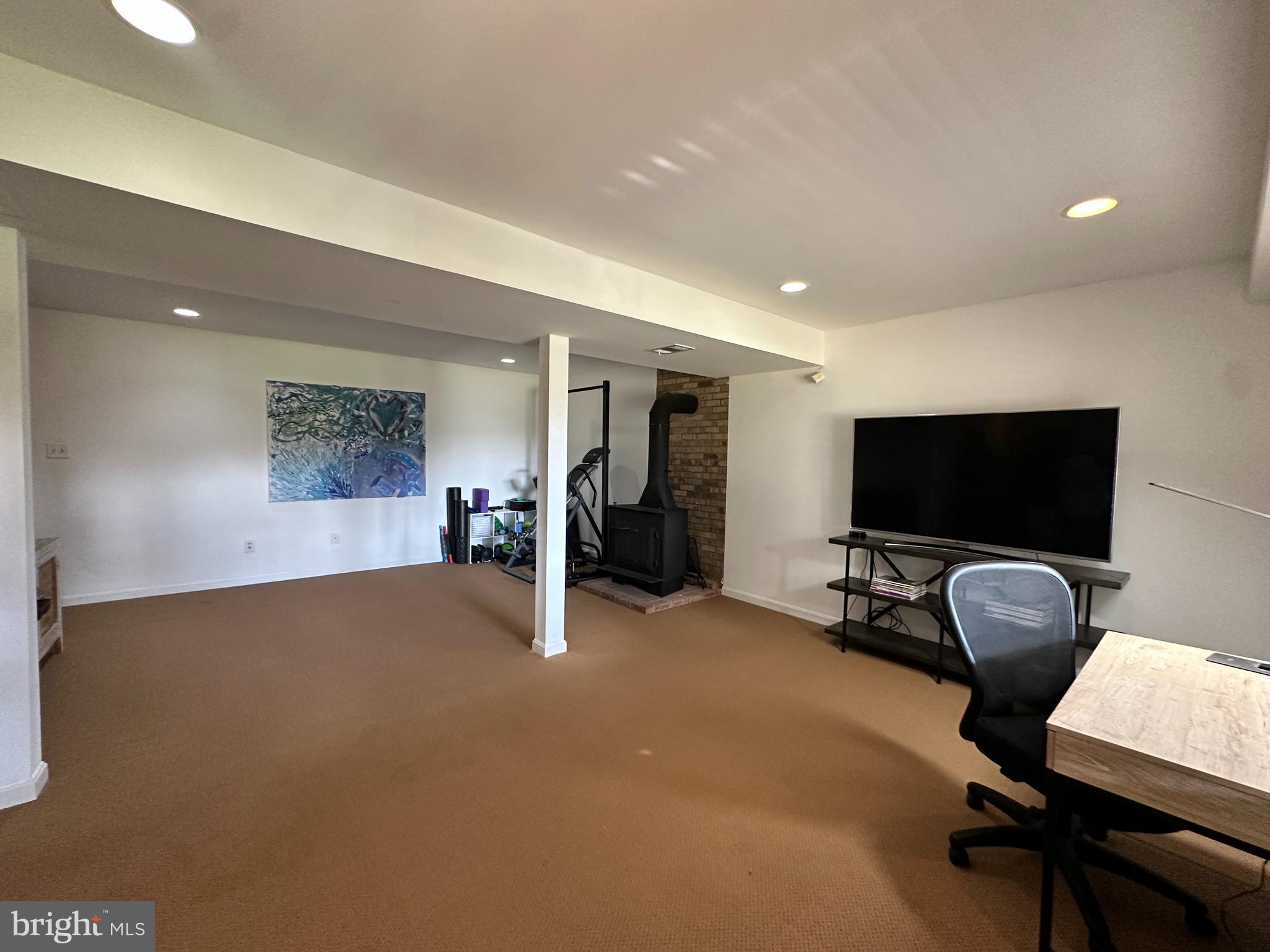 7601 Rudyard Street Falls Church, VA 22043 - Photo 20 of 29 a view of a livingroom with workspace and a couch