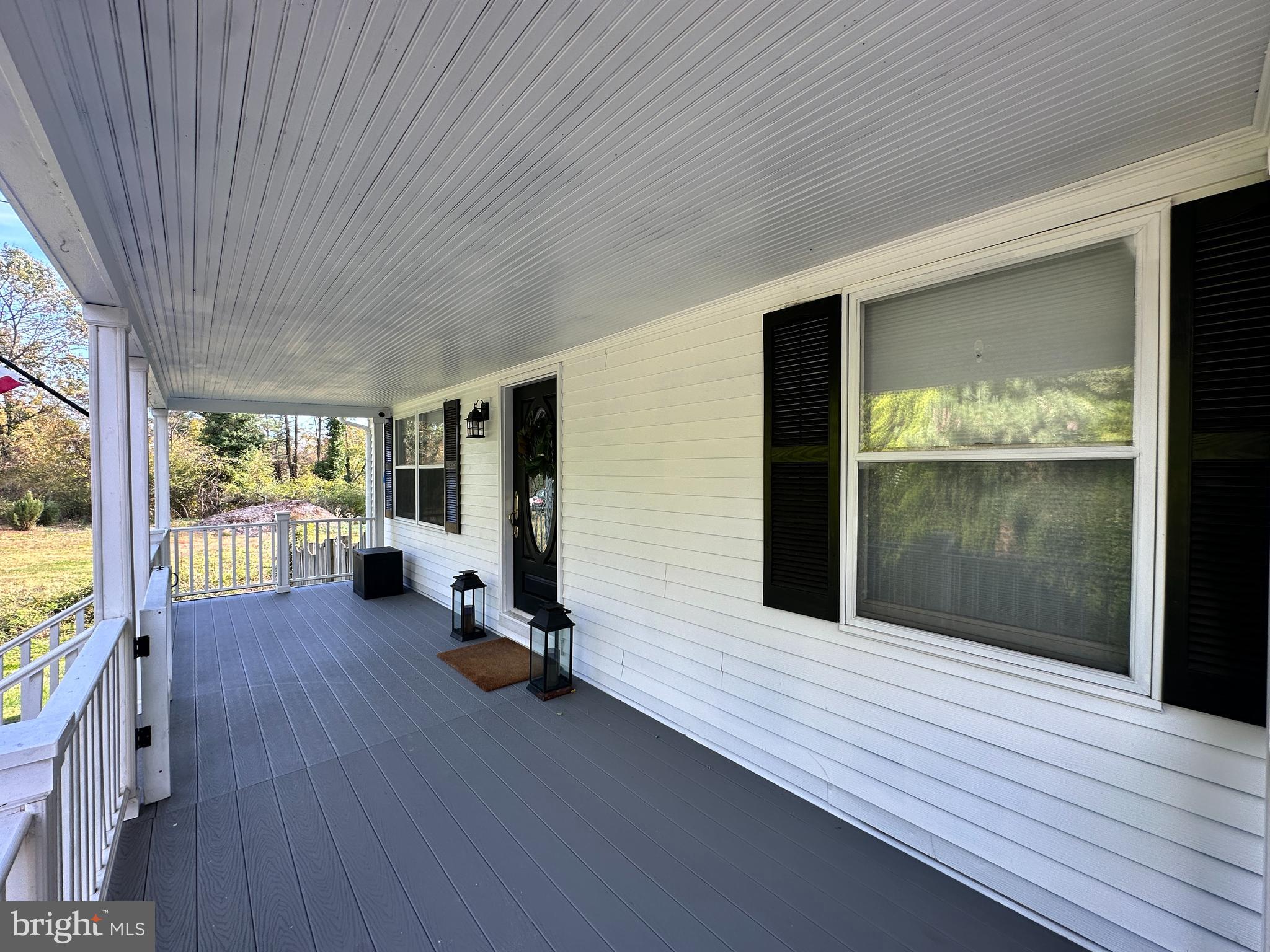 7601 Rudyard Street Falls Church, VA 22043 - Photo 2 of 29 a view of a hall with wooden floor and floor to ceiling window