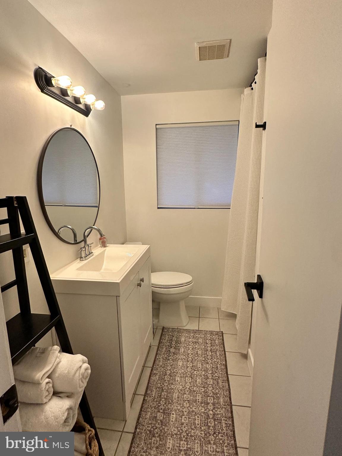 7601 Rudyard Street Falls Church, VA 22043 - Photo 25 of 29 a bathroom with a sink mirror vanity and toilet