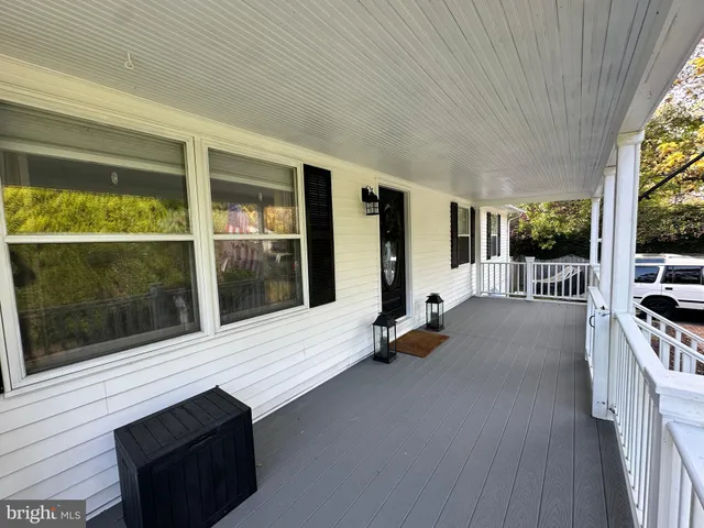 a view of a living room and floor to ceiling window
