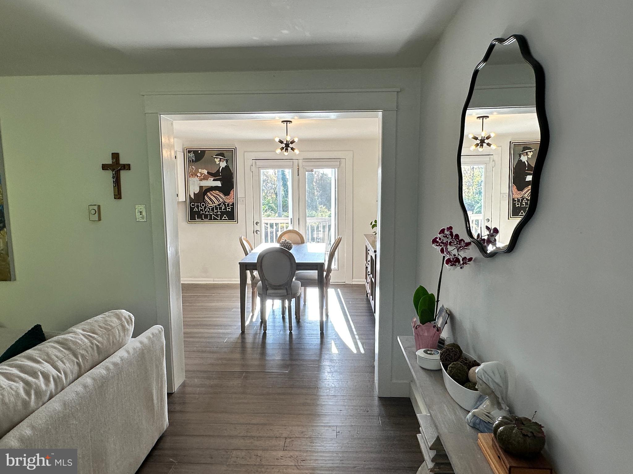 7601 Rudyard Street Falls Church, VA 22043 - Photo 3 of 29 a living room with furniture and a mirror