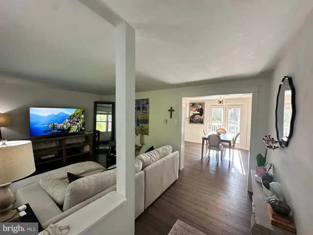 a living room with furniture fireplace and flat screen tv