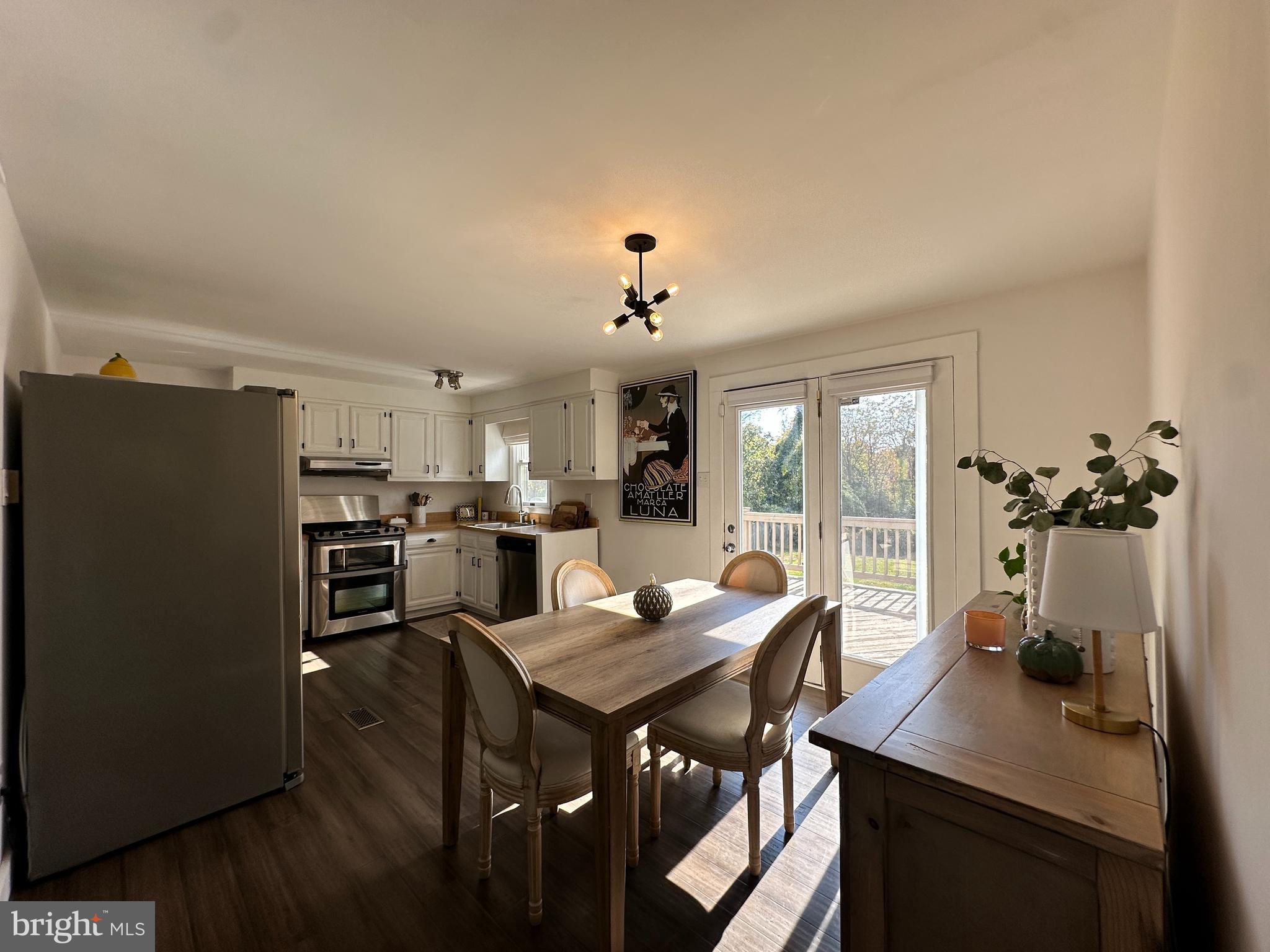 7601 Rudyard Street Falls Church, VA 22043 - Photo 7 of 29 a view of a dining room with furniture and a window