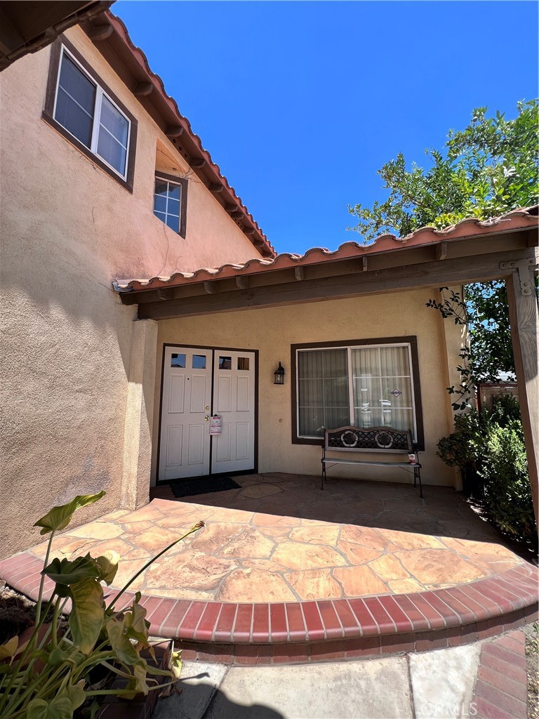 13764 Bay Fontana, CA 92336 - Photo 2 of 18 a front view of a house with a yard