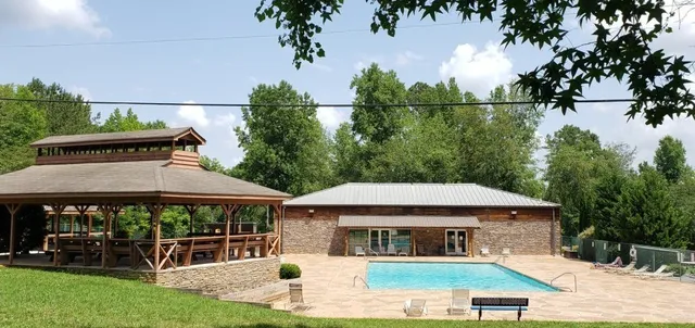a view of a house with backyard porch and sitting area