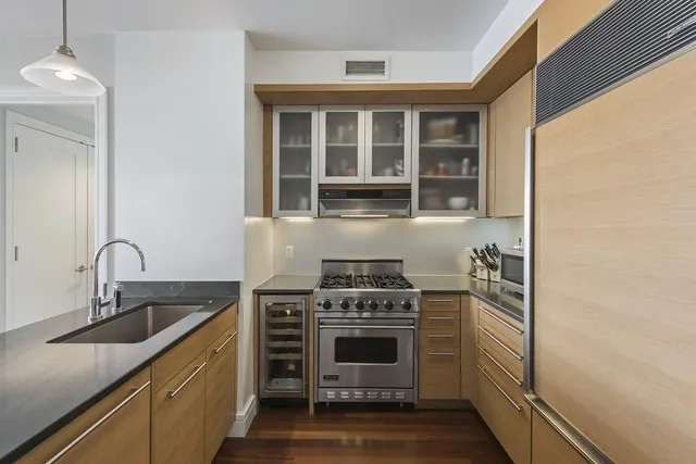 a kitchen with a stove and a sink