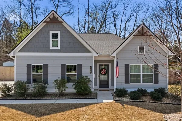 a front view of a house with garden