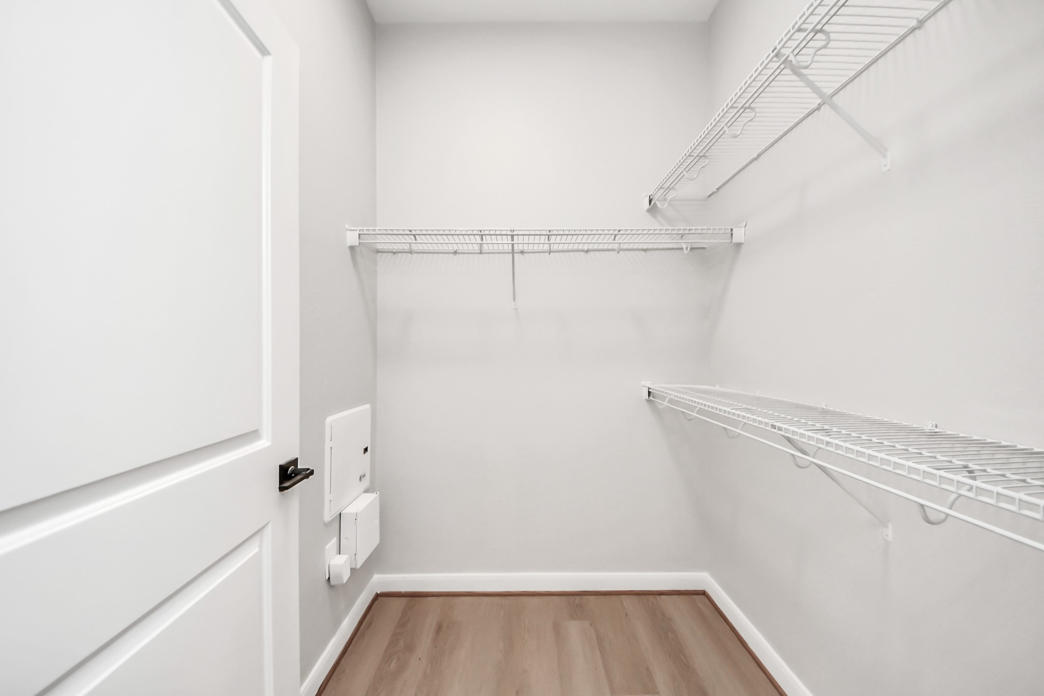6363 San Felipe Street, Unit 562 Houston, TX 77057 - Photo 25 of 43 a view of walk in closet with empty racks