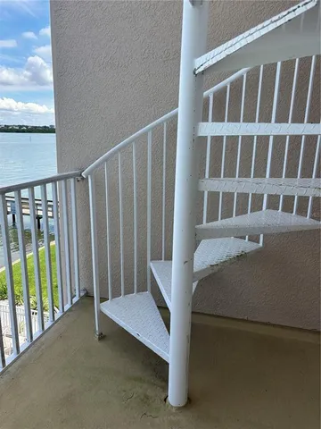a view of balcony with furniture