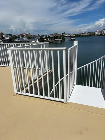 a view of balcony with furniture