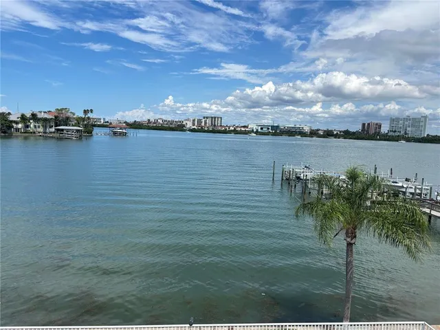a view of a lake with a yard