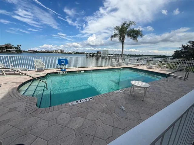 a view of a swimming pool with a patio