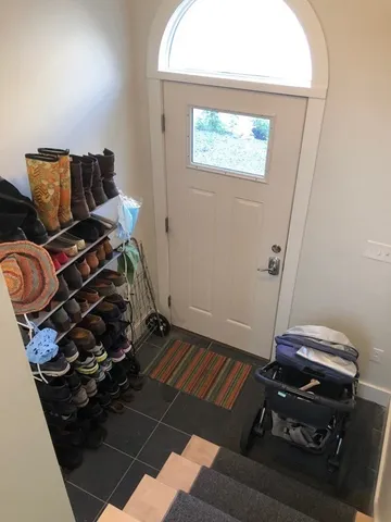 a view of a brick house with large windows