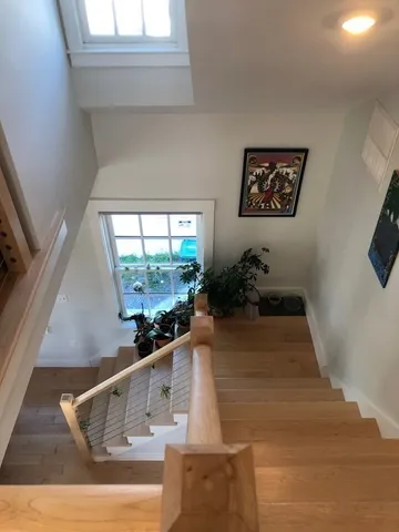 a kitchen with stainless steel appliances kitchen island granite countertop a refrigerator and a stove