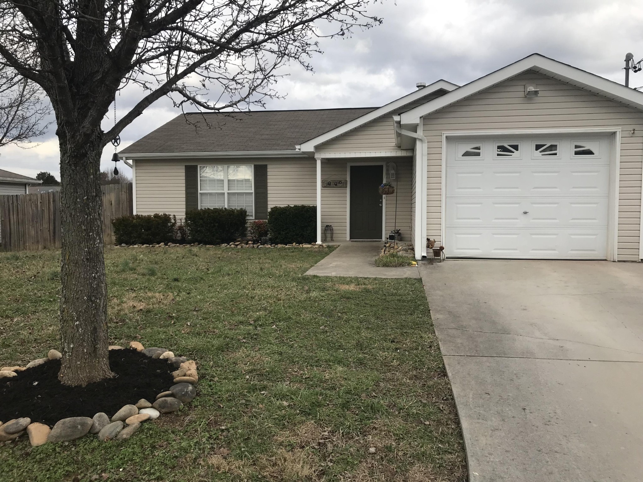 front view of a house with a yard