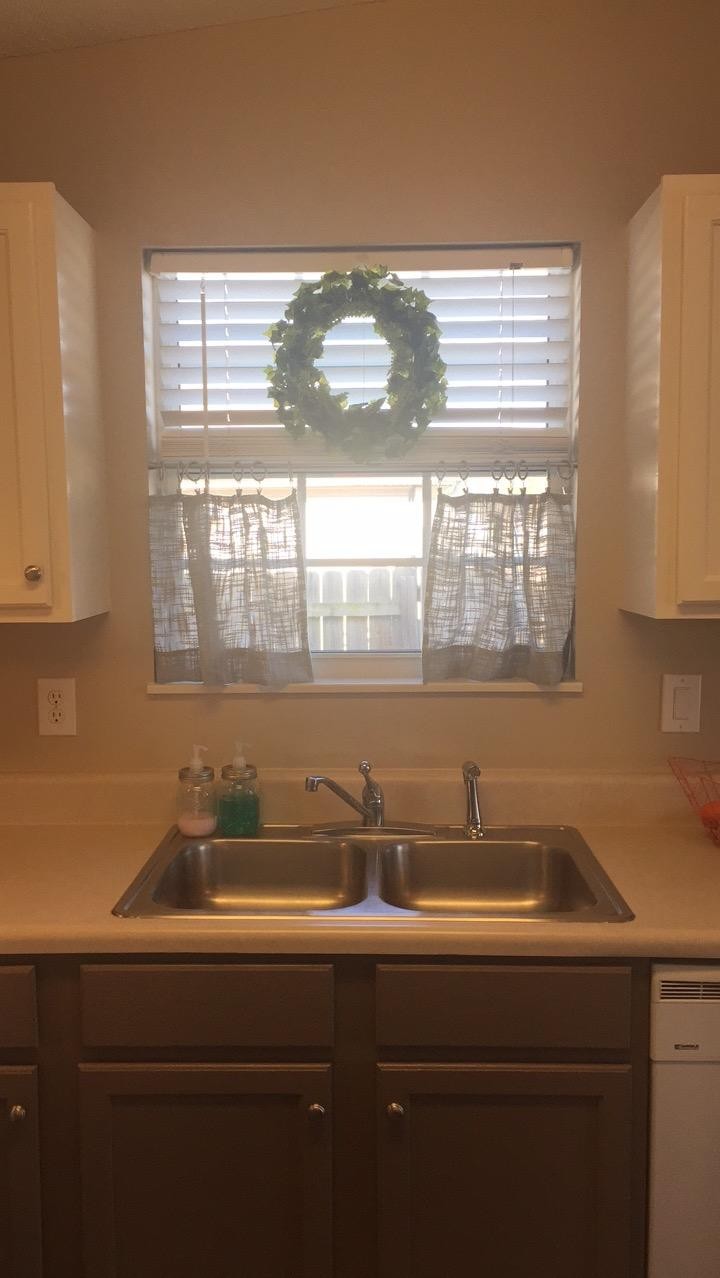 7557 Gary White Road Corryton, TN 37721 - Photo 3 of 23 a sink with a window and cabinets