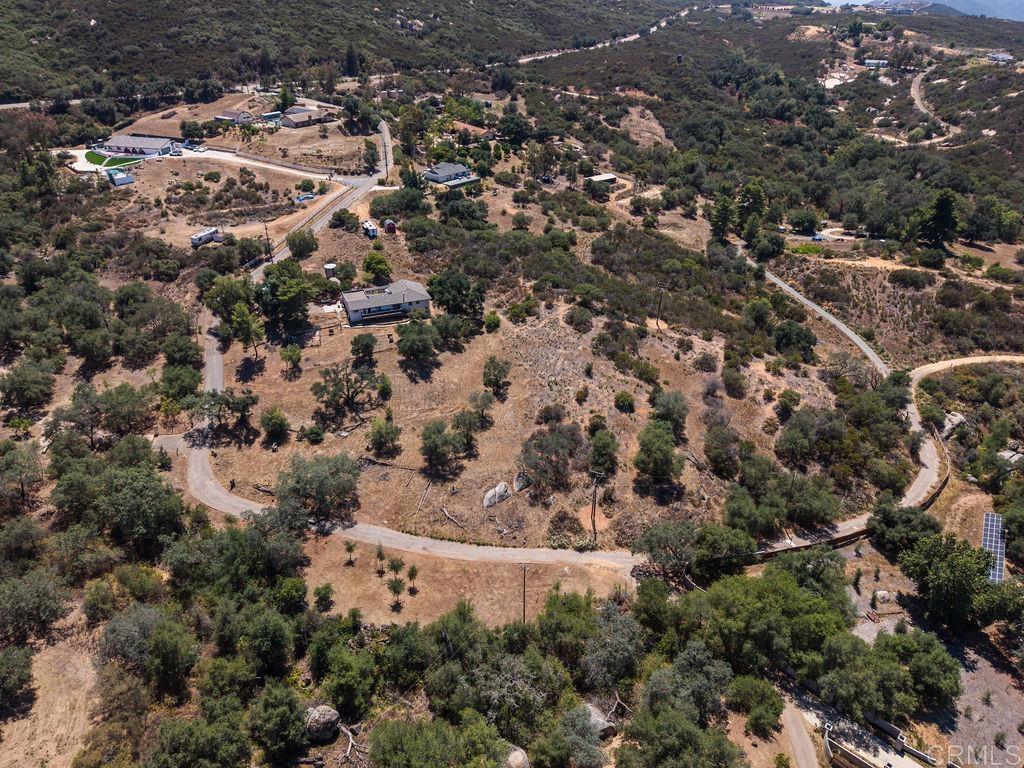 3340 Skytrail Ranch Road Jamul, CA 91935 - Photo 38 of 38 an aerial view of a houses with a yard