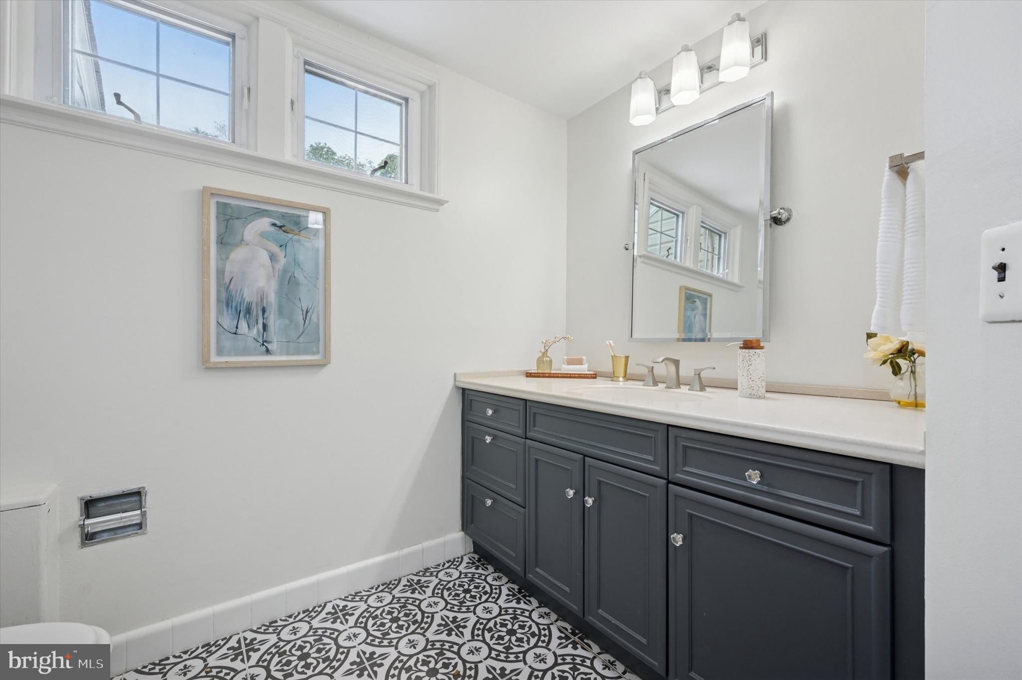 12 Rodney Road Bryn Mawr, PA 19010 - Photo 13 of 25 a bathroom with a sink and a mirror