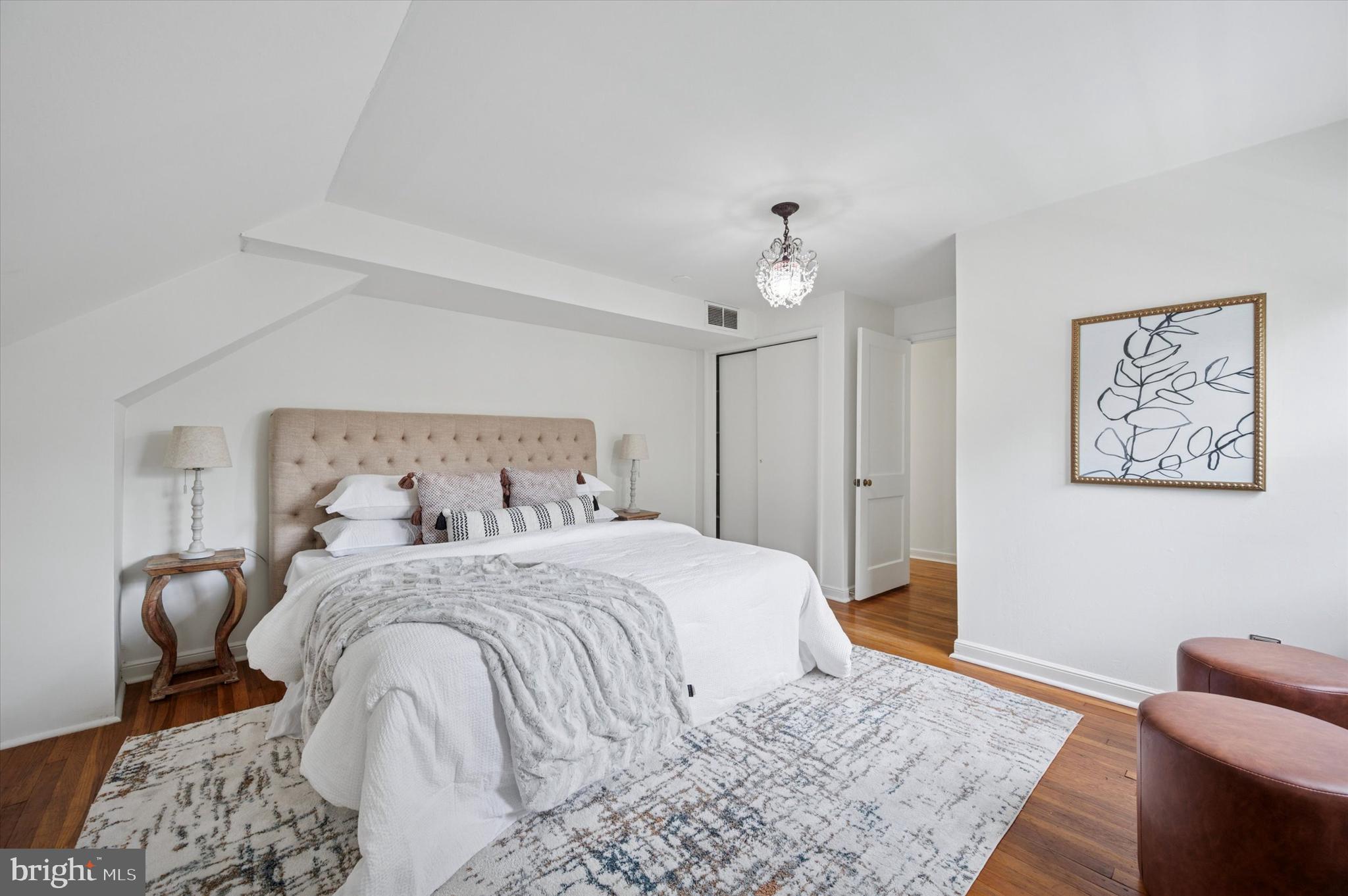 12 Rodney Road Bryn Mawr, PA 19010 - Photo 15 of 25 a bedroom with a bed and wooden floor