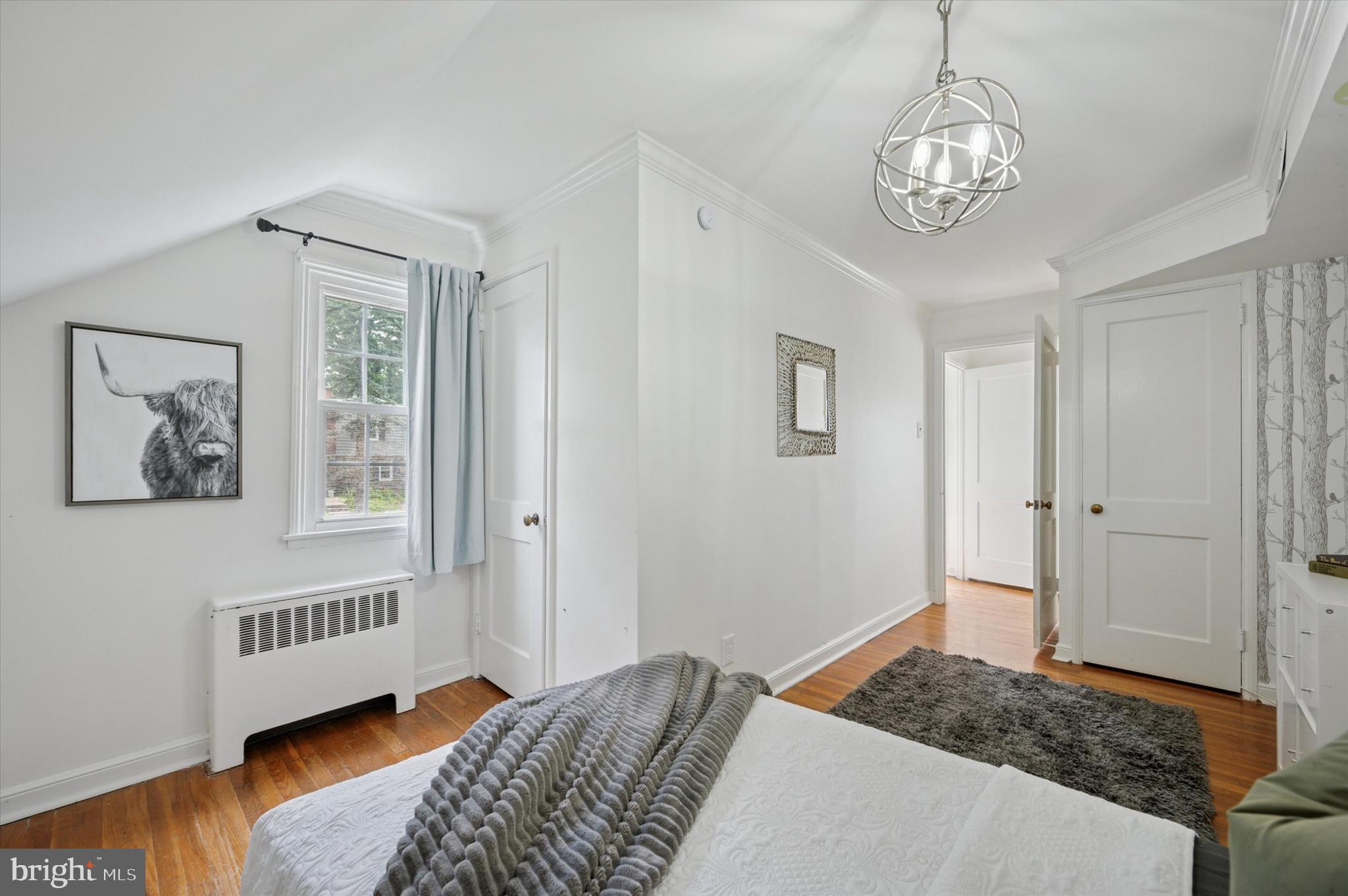 12 Rodney Road Bryn Mawr, PA 19010 - Photo 18 of 25 a bedroom with a bed and wooden floor
