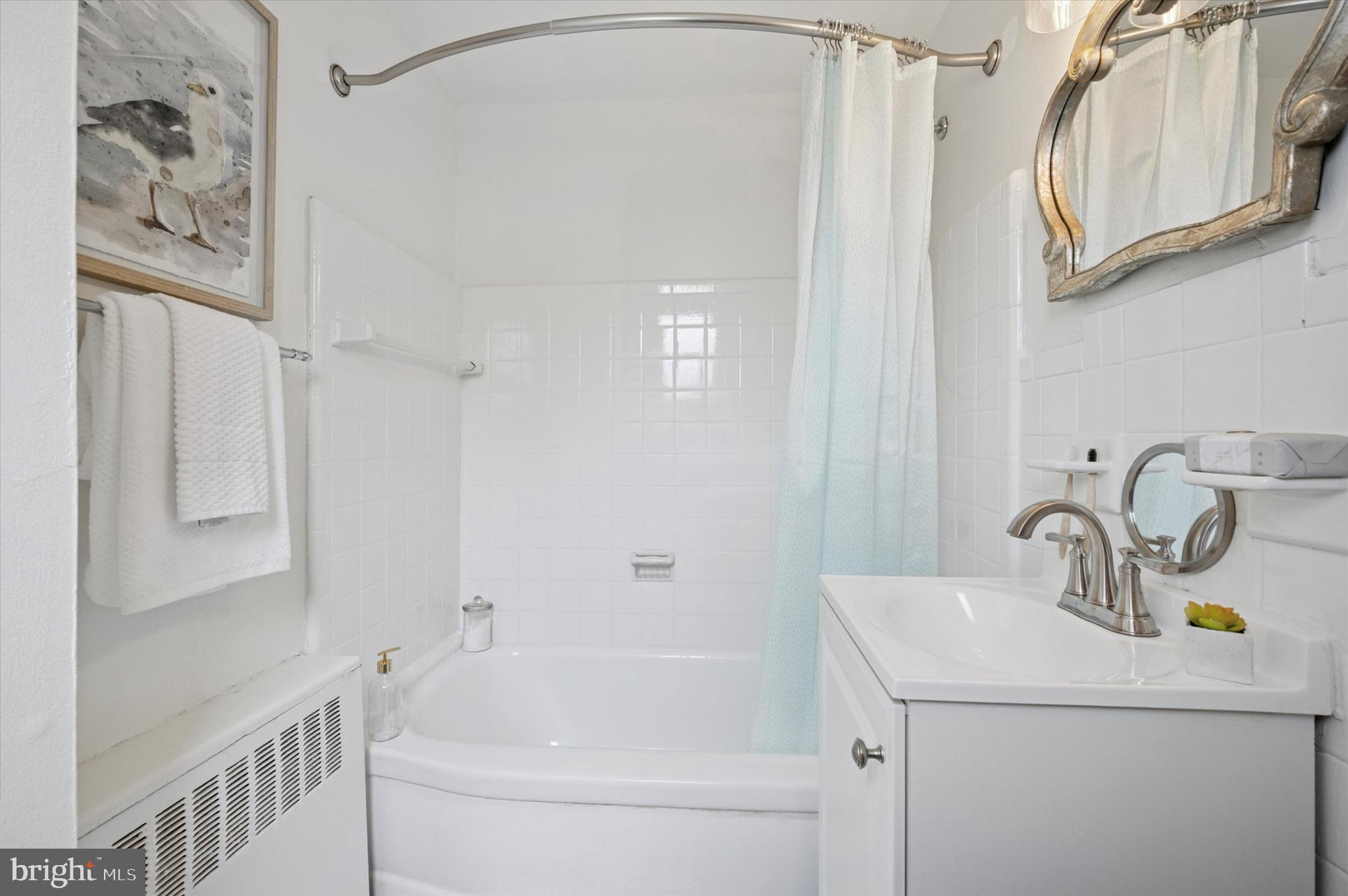 12 Rodney Road Bryn Mawr, PA 19010 - Photo 19 of 25 a bathroom with a sink a toilet and shower
