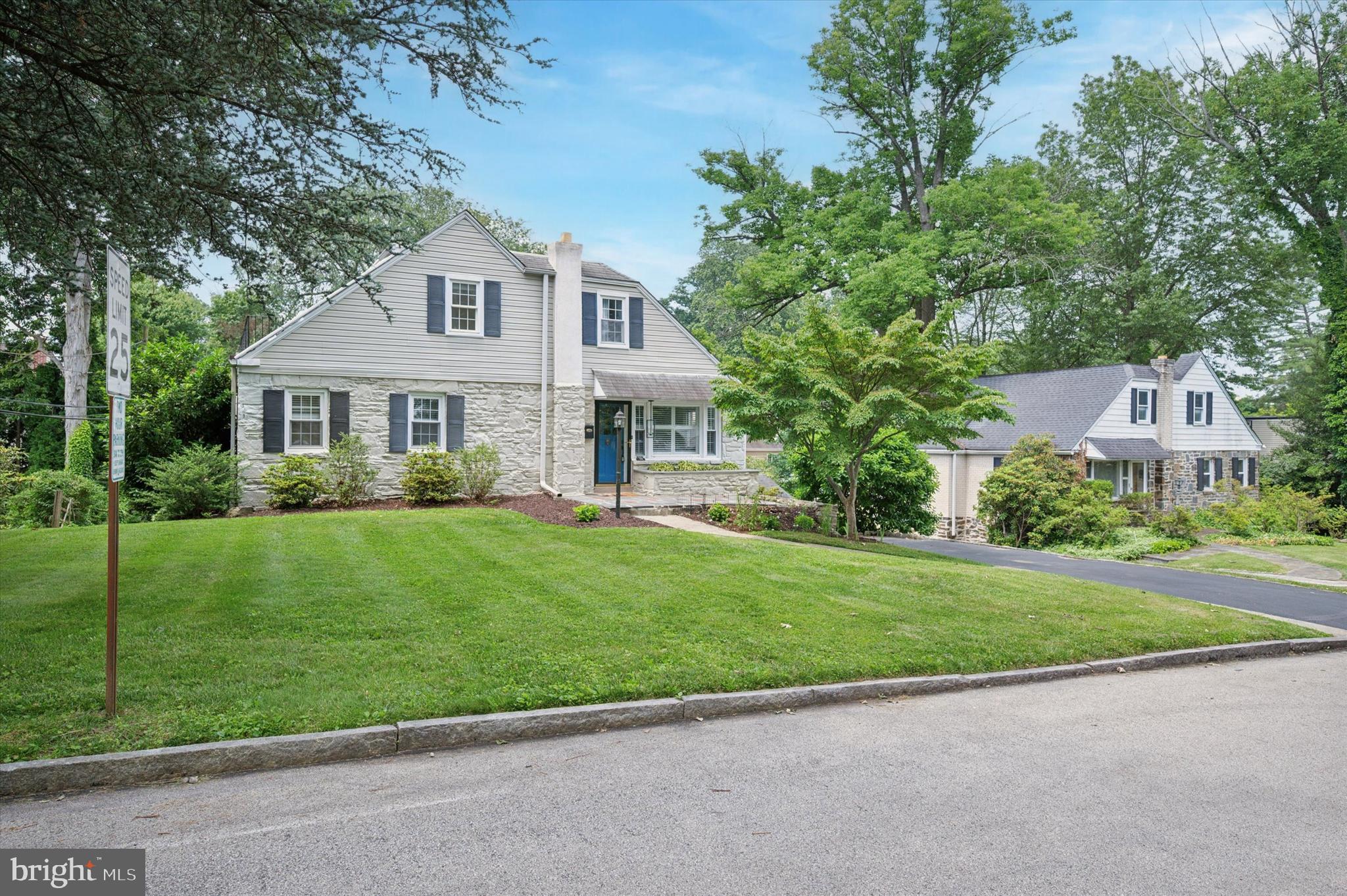 12 Rodney Road Bryn Mawr, PA 19010 - Photo 2 of 25 a front view of a house with a garden