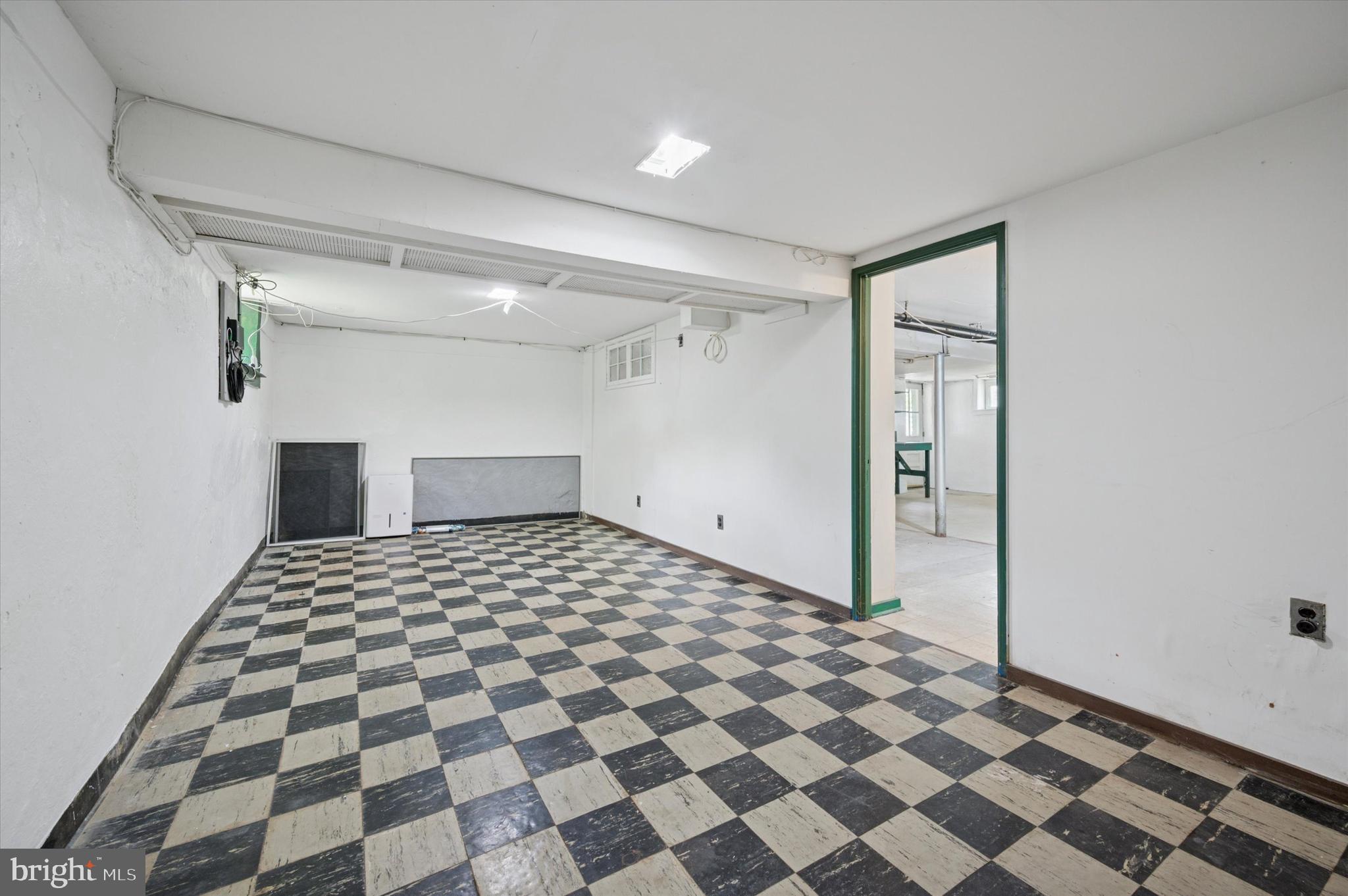 12 Rodney Road Bryn Mawr, PA 19010 - Photo 22 of 25 a bathroom with a black white checkered floor
