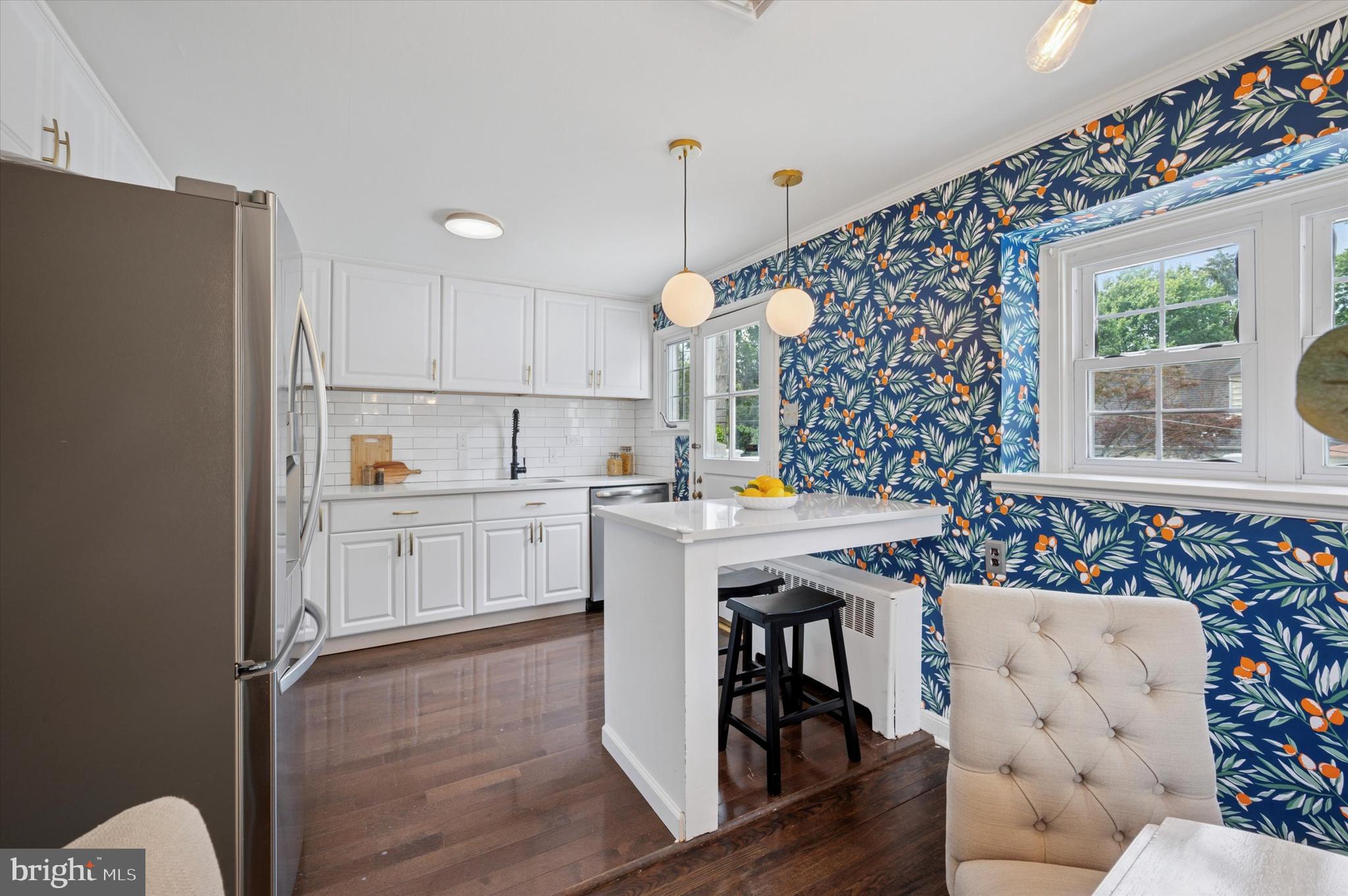 12 Rodney Road Bryn Mawr, PA 19010 - Photo 7 of 25 a kitchen that has a lot of white cabinets and wooden floor