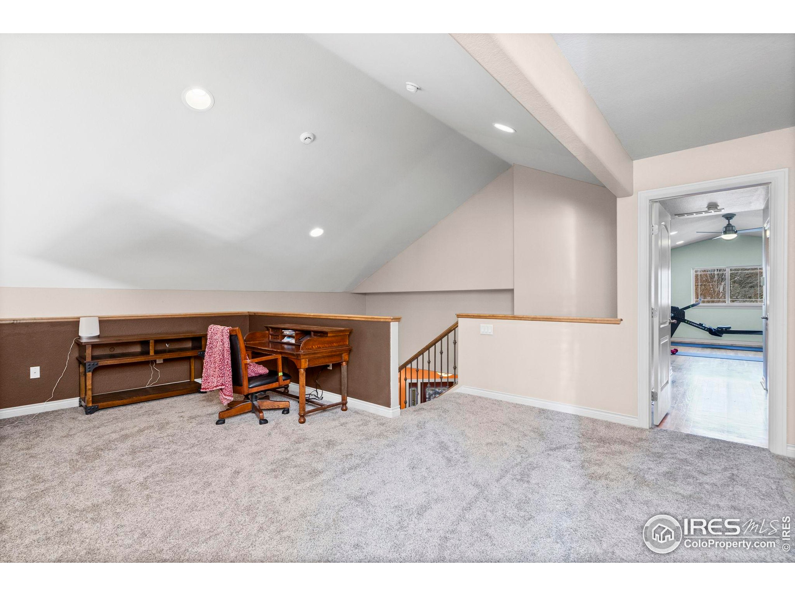 621 Roma Valley Drive Fort Collins, CO 80525 - Photo 28 of 50 a living room with furniture and a table