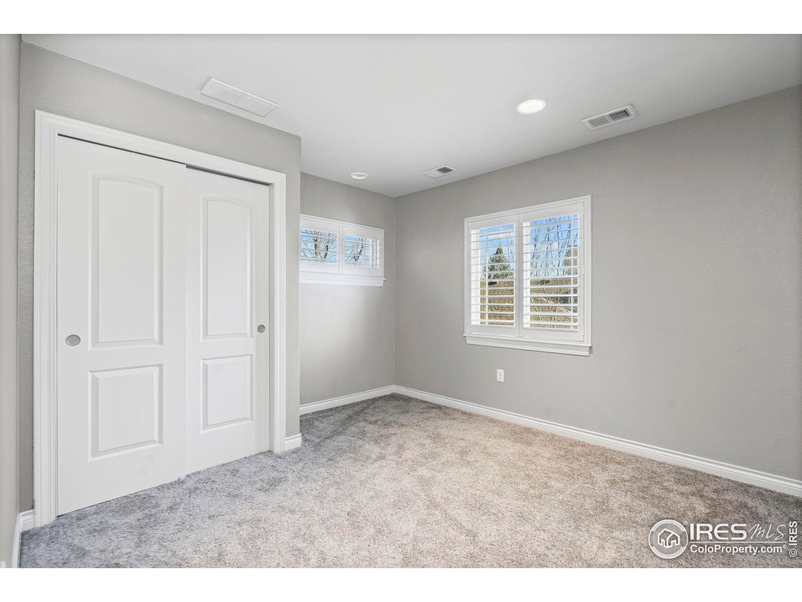 621 Roma Valley Drive Fort Collins, CO 80525 - Photo 34 of 50 a view of an empty room with a window