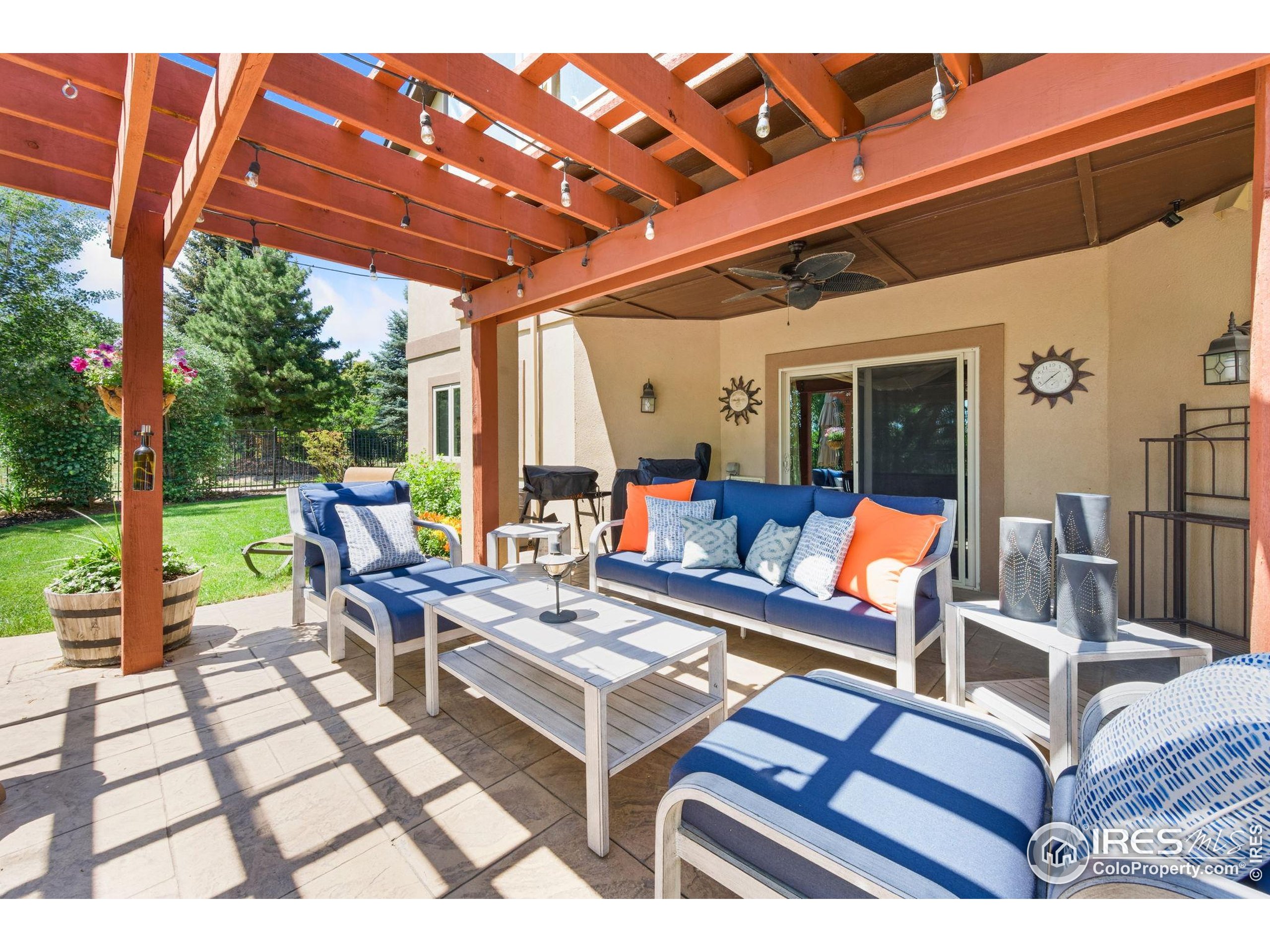 621 Roma Valley Drive Fort Collins, CO 80525 - Photo 49 of 50 a outdoor living space with furniture and garden view