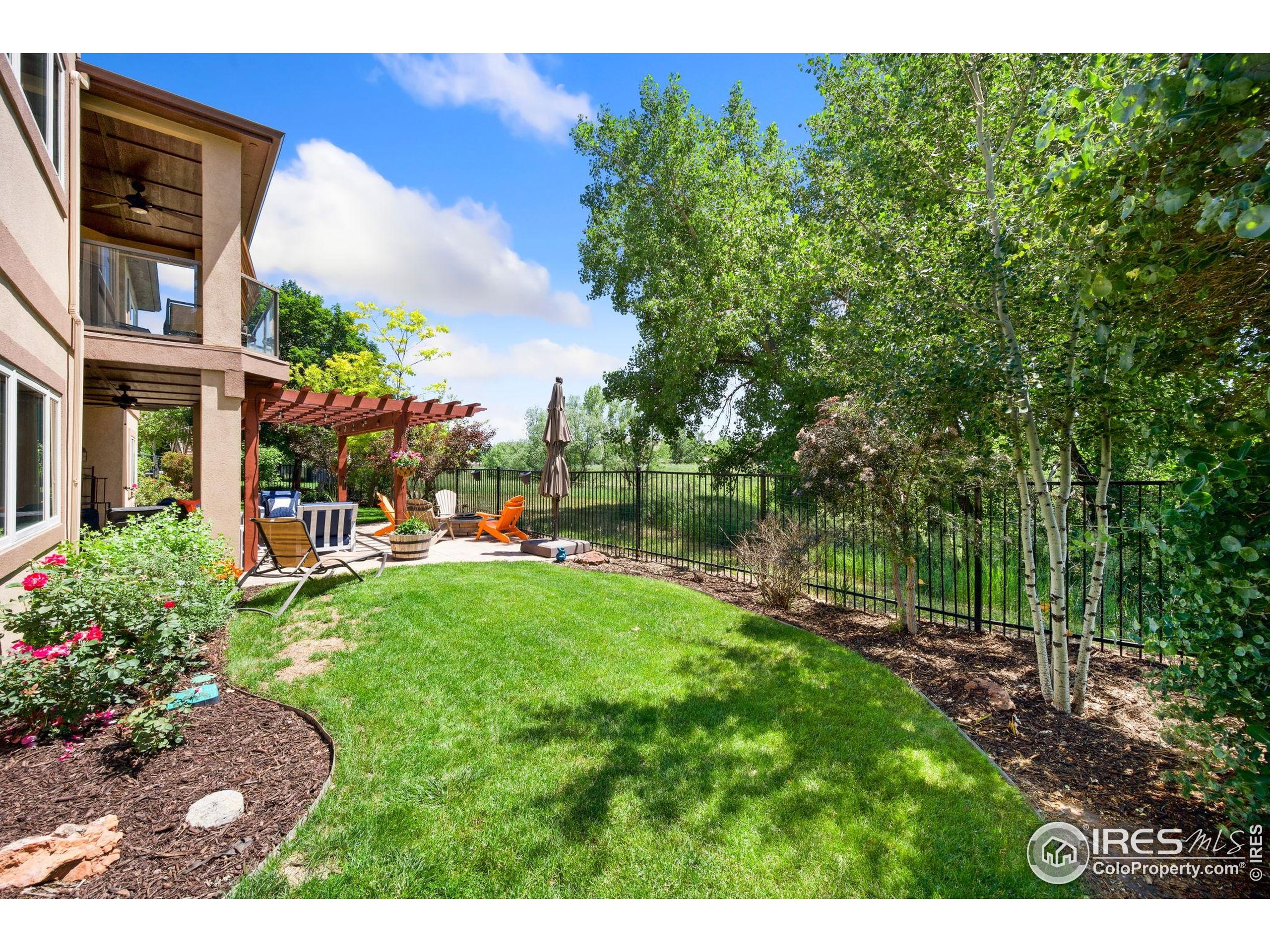 621 Roma Valley Drive Fort Collins, CO 80525 - Photo 50 of 50 a view of backyard with outdoor seating and green space
