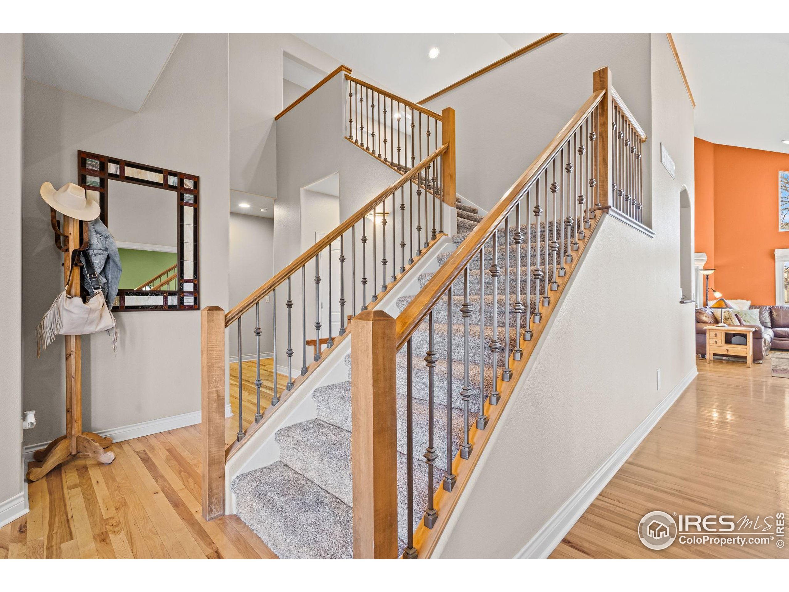 621 Roma Valley Drive Fort Collins, CO 80525 - Photo 5 of 50 a view of entryway and hall with wooden floor