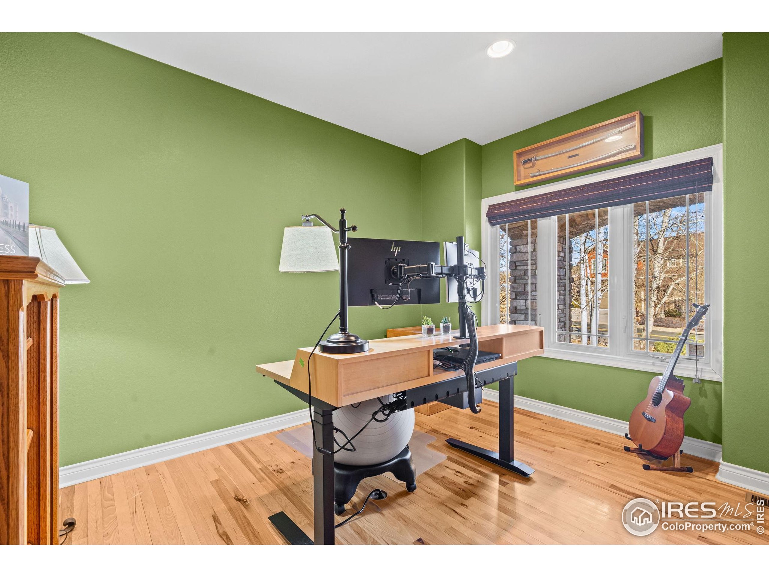 621 Roma Valley Drive Fort Collins, CO 80525 - Photo 6 of 50 a workspace with furniture and a window