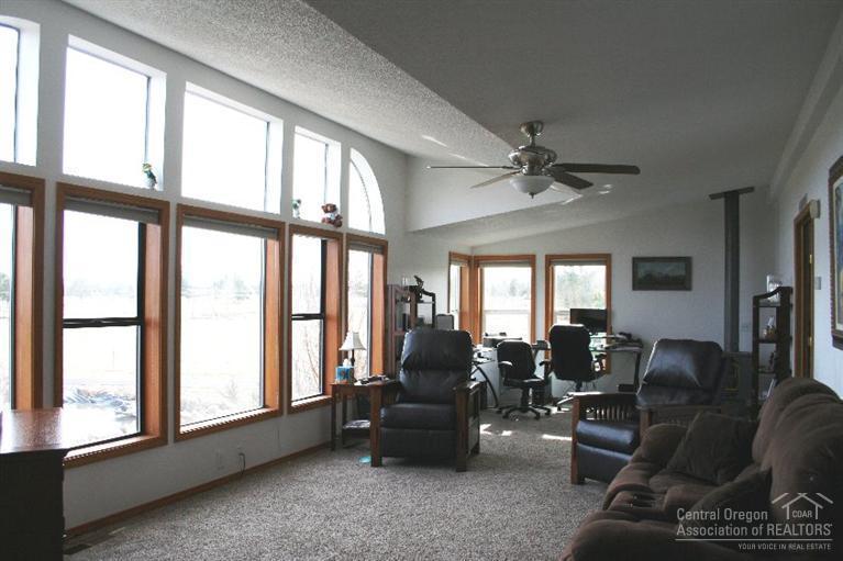 61153 Ropp Lane Bend, OR 97702 - Photo 13 of 25 a living room with furniture and a large window