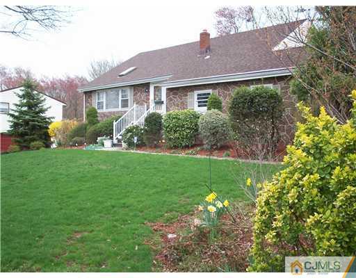 811 New Dover Road Edison, NJ 08820 - Photo 1 of 11 a view of a house with garden and yard