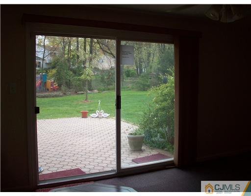 811 New Dover Road Edison, NJ 08820 - Photo 11 of 11 a view of a small yard from a window
