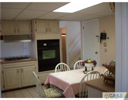 811 New Dover Road Edison, NJ 08820 - Photo 8 of 11 a kitchen with a sink and cabinets