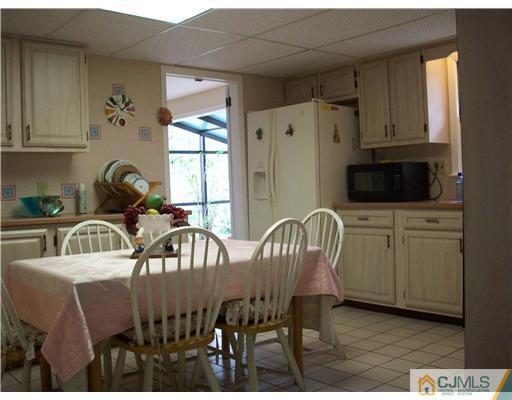 811 New Dover Road Edison, NJ 08820 - Photo 10 of 11 a view of a dining room with furniture window and outside view