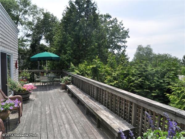 35 West Main Road Little Compton, RI 02837 - Photo 12 of 30 a view of a wooden deck with furniture