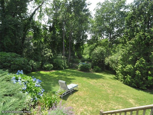 35 West Main Road Little Compton, RI 02837 - Photo 16 of 30 a view of a backyard with plants and a garden