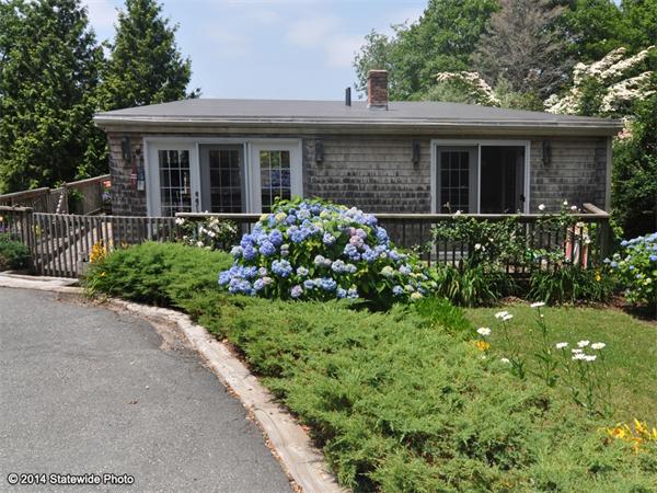 35 West Main Road Little Compton, RI 02837 - Photo 19 of 30 a front view of a house with a yard